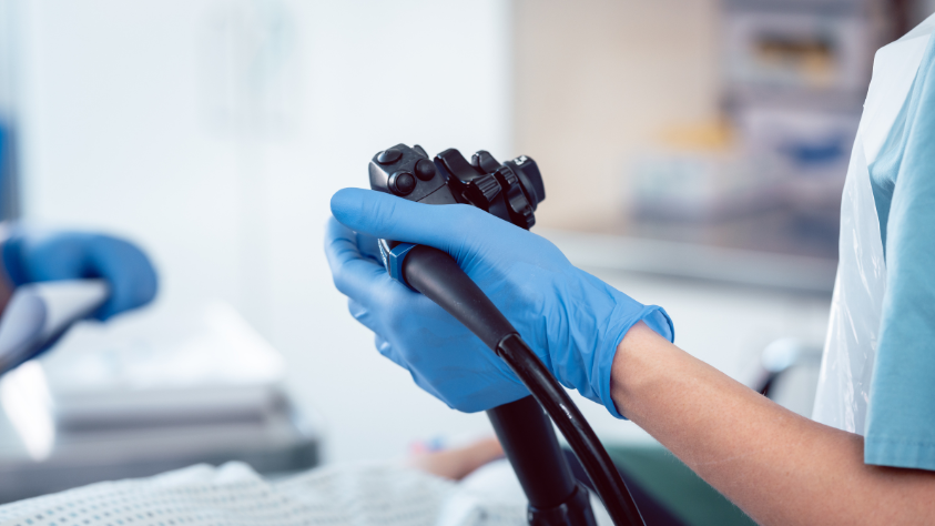 Healthcare professional holding a medical device