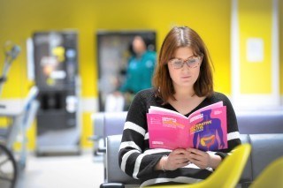 Woman reading information booklet